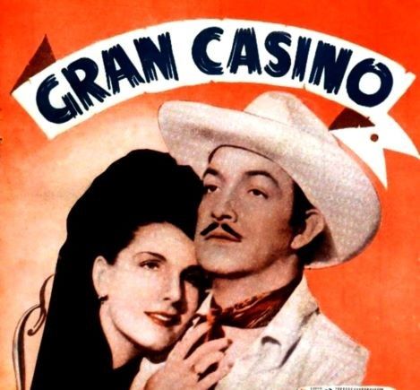 Afiche de la película "Gran Casino" de Luis Buñuel. Una mujer apoya su cabeza en el hombro del protagonista.